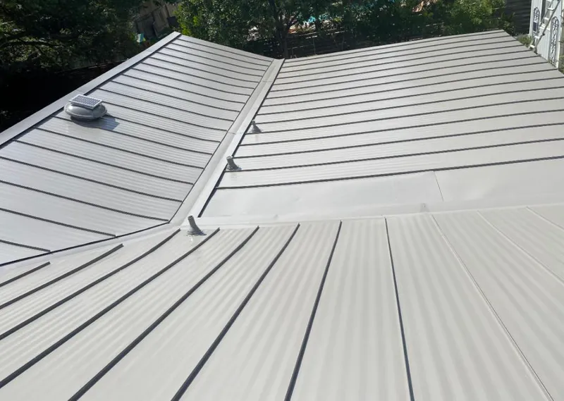 Solar attic fan installed on a metal roof for Roof Ventilation in Samsula-Spruce Creek